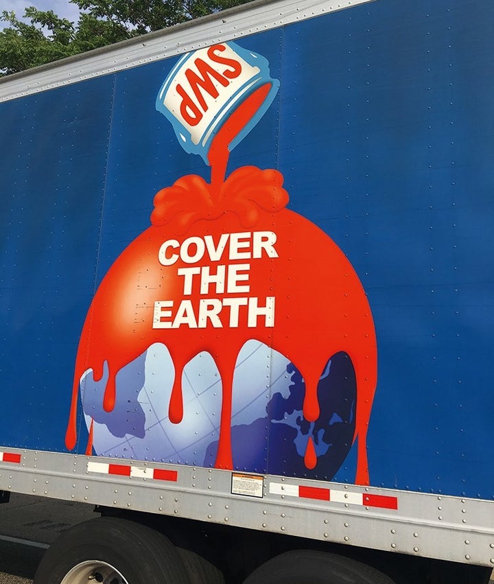 This classic graphic logo on the side of a speeding Sherwin-Williams paint delivery truck, carries an appropriate image for covering the good Earth in red. 