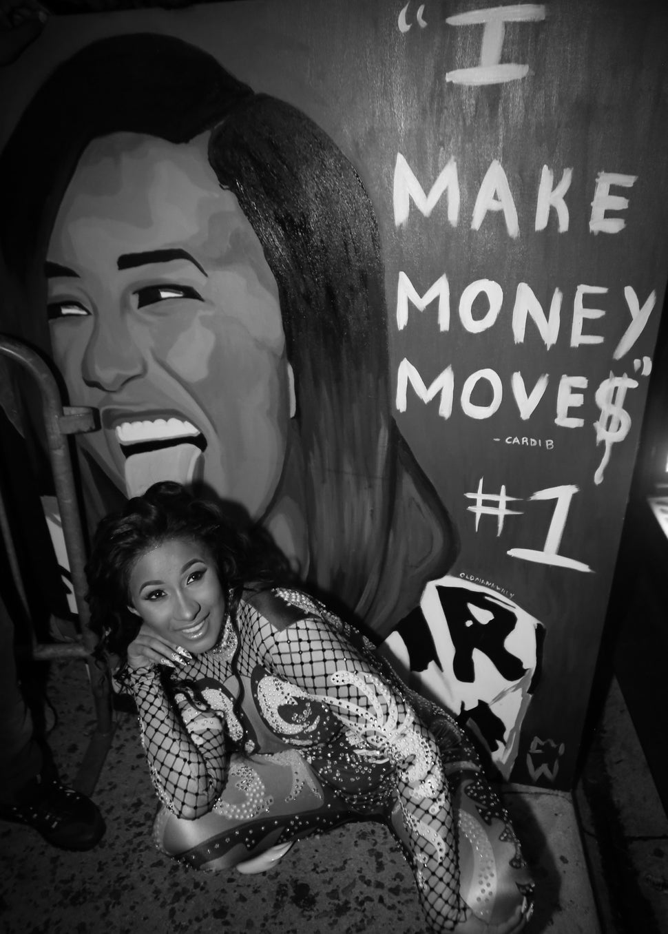 Cardi B poses with a fan made painting while leaving Revolution Live on Sept. 25, 2017 in Fort Lauderdale, Florida. 