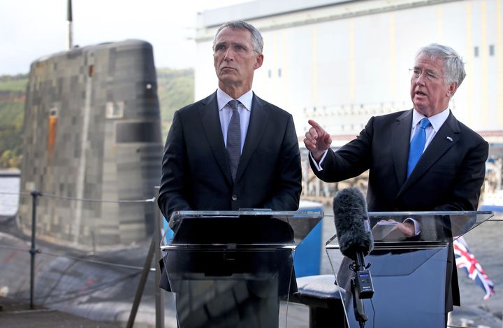 Defence Secretary Sir Michael Fallon and Nato Secretary General Jens Stollenberg speak to the media alongside the Vanguard-class nuclear deterrent submarine HMS Vengeance during a visit to HM Naval Base Clyde, Faslane