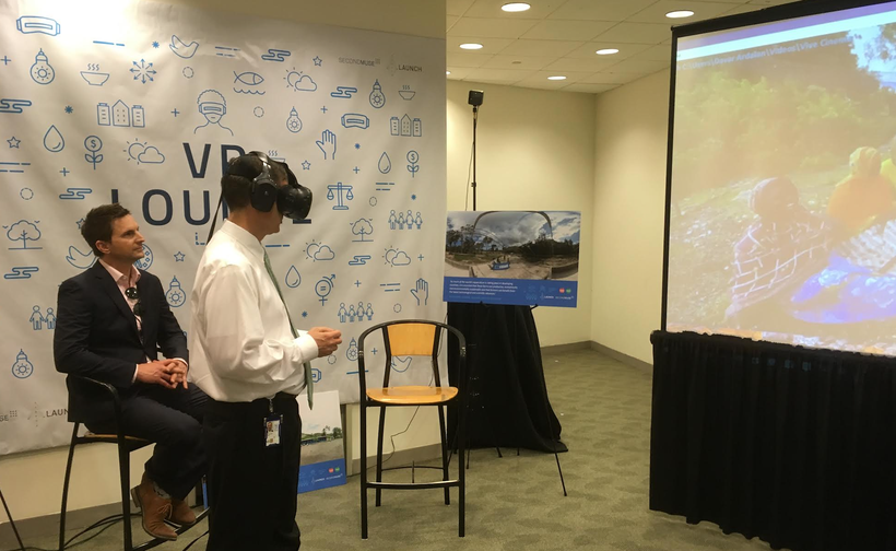 USAID Administrator Mark Green watching a 360/VR film featuring SeaPower, aquaculture innovators in Tanzania.