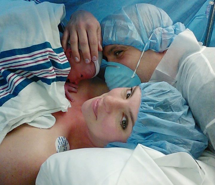 Jess Svabinek, a Starbucks employee, with her husband and newborn baby.