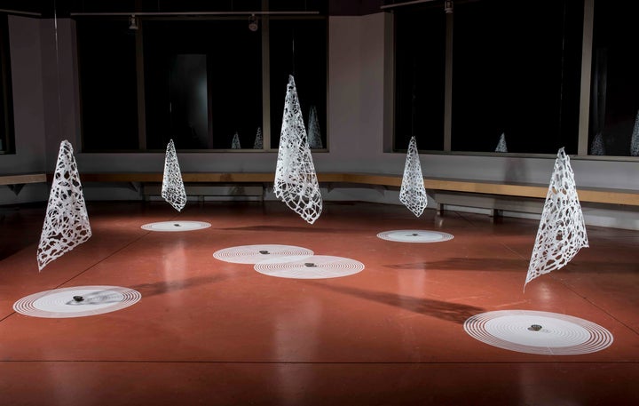 <p><em>Portal</em>, © 2014. Mylar, fossils; 150” x 150’ x 36.” Sound Design by Susan Alexjander.</p>