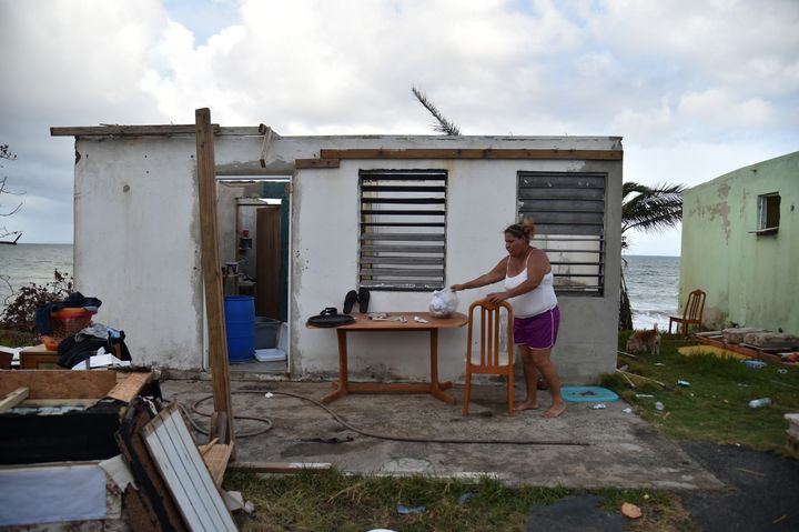 A local is pictured in her damaged house in Yabucoa, in the eastern part of the island, on Thursday