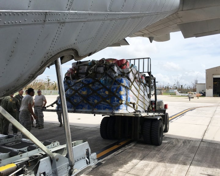 Airmen from the Puerto Rico Air National Guard unload supplies from a C-130 Hercules at Muniz Air National Guard Base in Puerto Rico in response to Hurricane Maria, Sept. 23, 2017. The Puerto Rico Air National Guard is working with numerous local and federal agencies in response to Hurricane Maria.