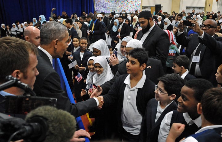 Obama greets students from Al-Rahmah school during his visit to the Islamic Society of Baltimore.