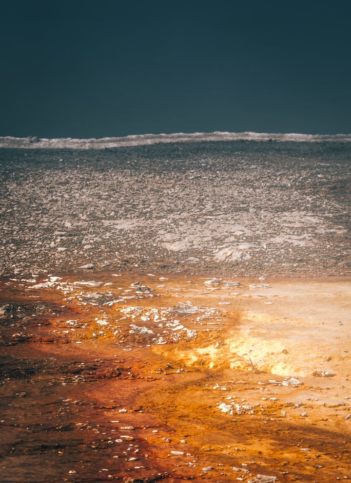 The edge of Black Pool in the West Thumb Geyser Basin