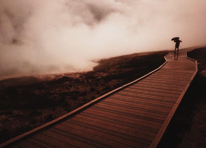 The boardwalk at Grand Prismatic Spring during a rain storm