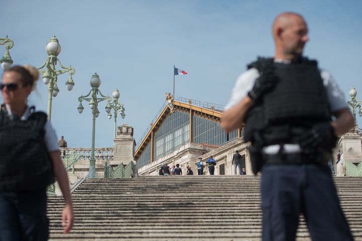 A French police officer stands outside Saint-Charles train station in Marseille
