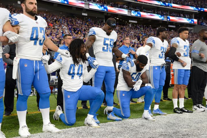 Jalen Reeves-Maybinof the Detroit Lions and teammate Steve Longa take a knee during the national anthem before the game against the Minnesota Vikings on Oct. 1 at U.S. Bank Stadium in Minneapolis, Minnesota.