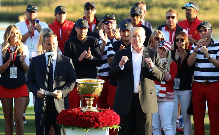 President Donald Trump presented the U.S. team with the trophy after they defeated the international team in the Presidents Cup at Liberty National Golf Club. 