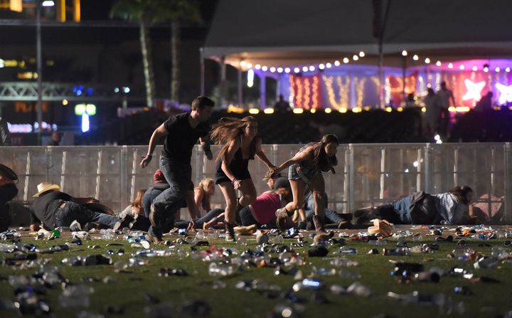 People flee from the Route 91 Harvest country music festival after gunfire was heard. 