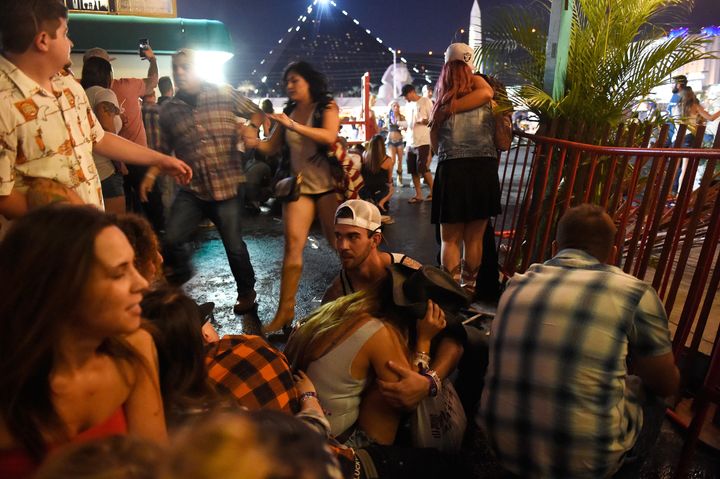 People run for cover at the Route 91 Harvest country music festival after gunfire erupted
