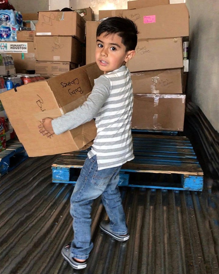 <p>A Young Helper Loading the Truck</p>