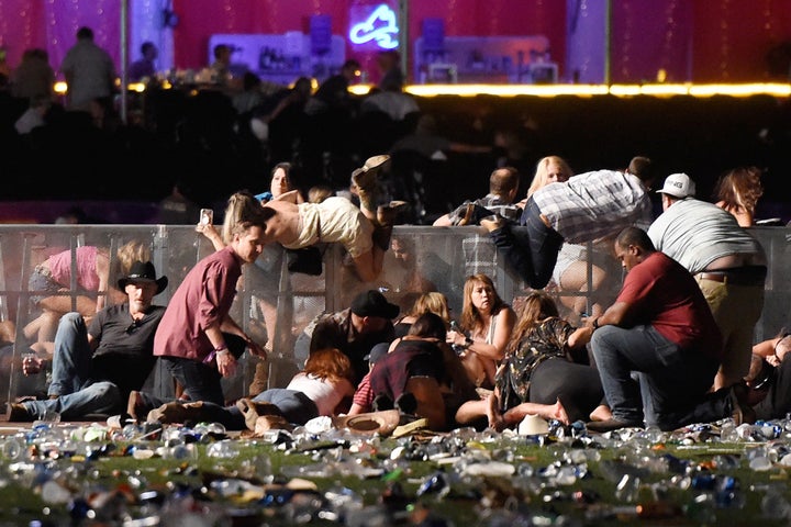 After gun shots rang out, people scrambled for shelter at the Route 91 Harvest music festival in Las Vegas on Oct. 1, 2017.