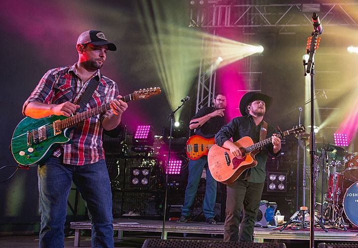 Caleb Keeter, left, performs with the Josh Abbott Band in 2016.