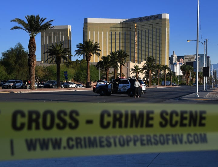 Crime scene tape surrounds the Mandalay Hotel (background) after a gunman killed at least 58 people.