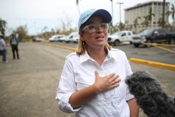 San Juan Mayor Carmen Yulín Cruz speaks to the media as she arrives at the temporary government center at Roberto Clemente Stadium on Sept. 30.