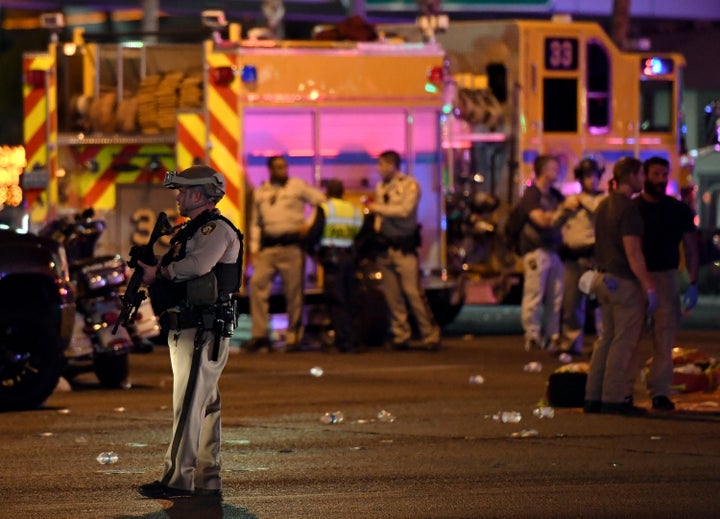 A police officer stands in the intersection of Las Vegas Boulevard and Tropicana Avenue on Oct. 2 after the mass shooting.