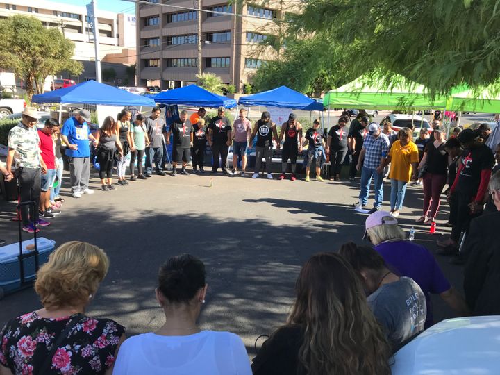 A prayer circle formed outside University Medical Center in Las Vegas on Monday.