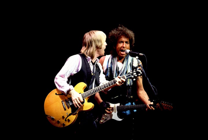 Tom Petty (left) and Bob Dylan perform onstage at the Poplar Creek Music Theater in Hoffman Estates, Chicago, Illinois, July 22nd, 1986