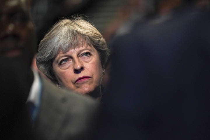 “I think it’s up to America what gun laws they put in place,” Theresa May said Tuesday.