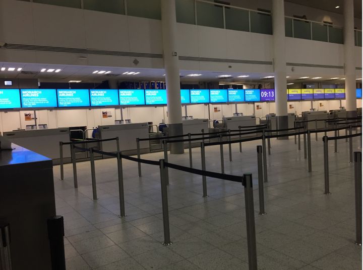 Deserted Monarch check in desks at Gatwick Airport just hours after the company's collapse was announced 