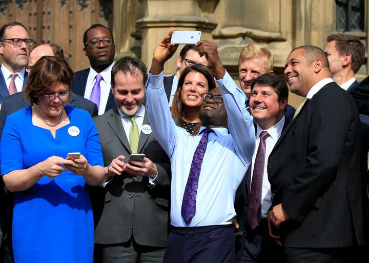 Sam Gyimah taking a selfie with other Tory MPs.