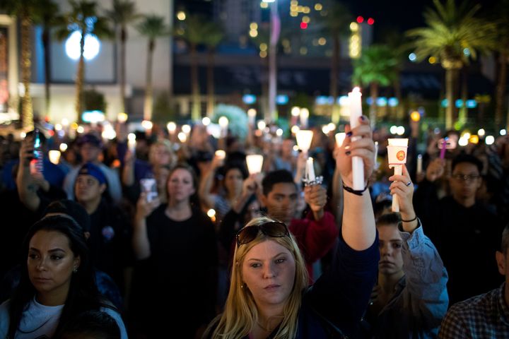 Mourners at a vigil in Las Vegas after 59 people were killed a gun attack