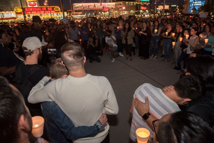 People comfort each other during the vigil. 