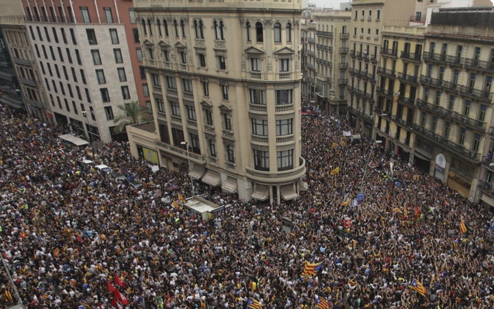 People gather to stage a demonstration within the general strike, supporting Catalonian independence and reacting against Spanish police's intervention in polling centers.