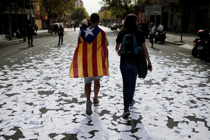 People gather to stage a demonstration within the general strike, supporting Catalonian independence,