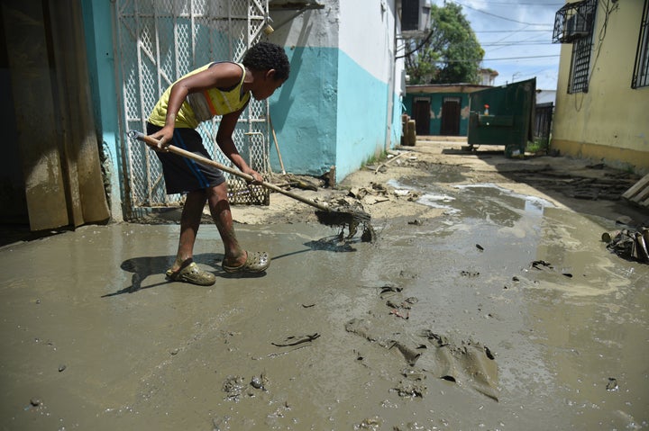 A child helps clean-up efforts in Toa Baja on Oct. 2, 2017.