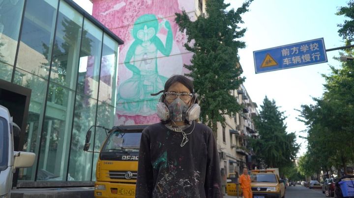 Fansack / Chendu, China In front of her mural