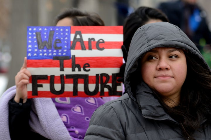 <p> Madison, WI, USA- February 18, 2016 - group of people protesting new Wisconsin immigration laws </p>