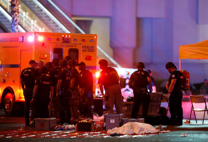 First responders gather near a victim of the mass shooting in Las Vegas on Oct. 1, 2017.