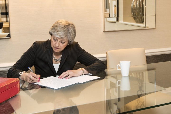 Theresa May puts the final touches to her party conference speech.