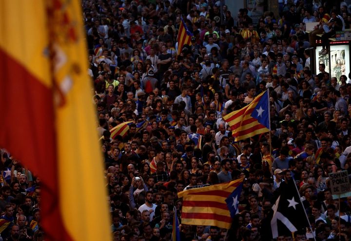 People gather at Spanish police headquarters to stage a demonstration, supporting Catalonian independence and reacting against Spanish police's intervention, in Barcelona.