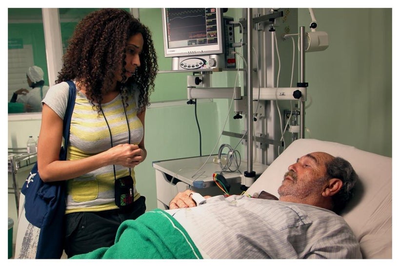 Miriam (Yuliet Cruz) visits the dying Hugo (Manuel Porto) in a scene from <strong><em>Esteban</em></strong>