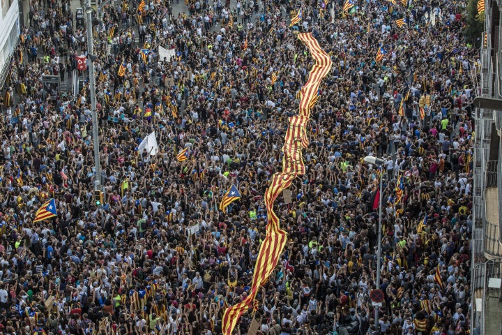 Tens of thousands of demonstrators took to the streets in Barcelona to protest against alleged police violence in Barcelona during the the Catalan independence referendum