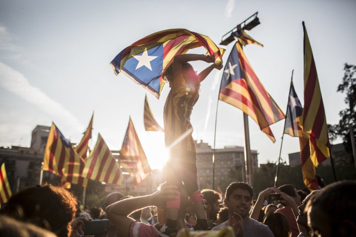 Demonstrators wave Catalan flags during the demonstration