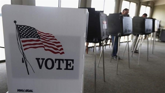 Voters cast their ballots in an Illinois primary. State election officials often come under fire for their handling of voter
