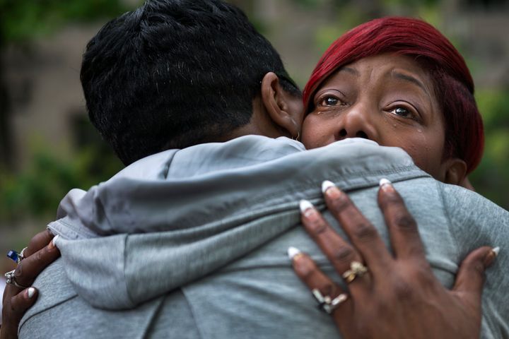 WASHINGTON, DC - MAY 9: Maria Hamilton, founder of Mothers For Justice United, cries as she gets a hug from Pastor Traci Blackmon at the Million Mom March in Washington, DC on May 9, 2015. Her son Donte, who had been with paranoid schizophrenia, was shot and killed by a Milwaukee police officer in 2014. Maria along with hundreds of supporters and other mothers turned out for the Million Mom March to protest child gun deaths, including those at the hands of police. The women marched to the offices of the Department of Justice and presented their demands for justice and racial equality, in the names of their slain children. Among those demands, asking that the federal government keep a registry of officer-involved shootings and investigate each one, the halt of supplying police forces with military equipment, and that body cameras not have the ability to be turned off and on by officers. (Photo by Linda Davidson / The Washington Post via Getty Images)