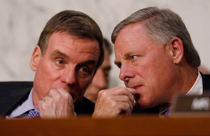Senate Intelligence Committee vice chairman Sen. Mark Warner and chairman Sen. Richard Burr listen as U.S. Attorney General J