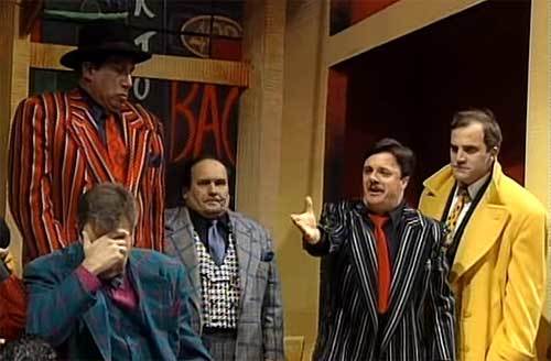 <p>Ernie Sabella (wearing the grey plaid jacket) & Nathan Lane (wearing the black striped jacket) in the 1992 revival of “Guys & Dolls.”</p>