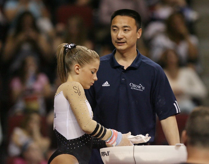 Liang Chow talks with Shawn Johnson during day 3 of the Visa Championships at Agganis Arena June 7, 2008 in Boston, Massachusetts.