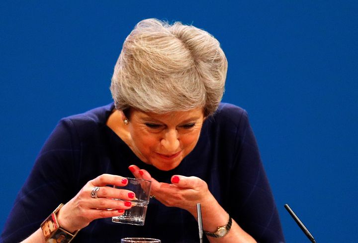  Theresa May suffered a coughing fit.
