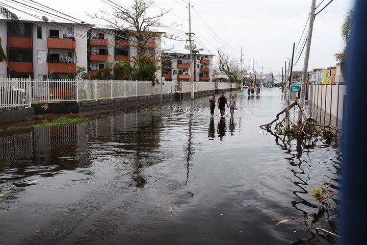 Puerto Rican residents walk in flooded streets in Condado, San Juan, Puerto Rico, Sept. 22, 2017, following Hurricane Maria. Source: Puerto Rico National Guard. Photo by Sgt. Jose Ahiram Diaz-Ramos.