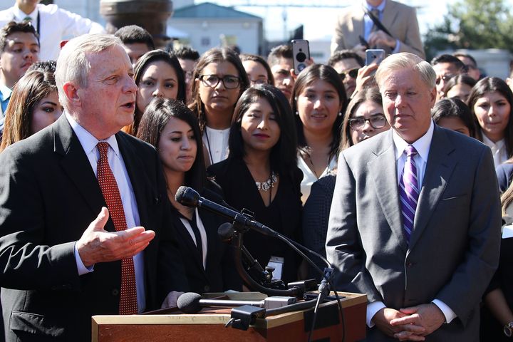 Sens. Dick Durbin (D-Ill.) and Lindsey Graham (R-S.C.) speak in support of the Dream Act with Deferred Action for Childhood Arrivals recipients who traveled to Washington to advocate for their cause.