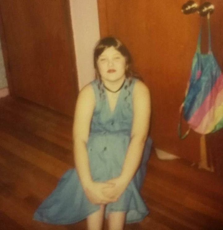 Me, circa fifth grade, wearing an adult L denim dress. 