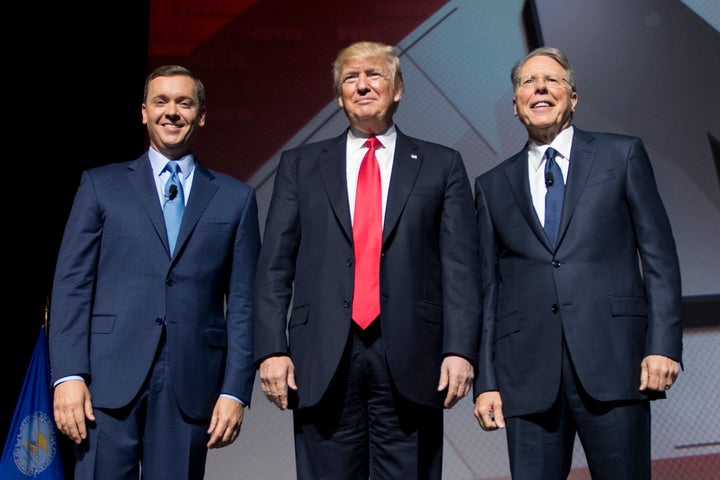 President Donald Trump (center) stands beside NRA CEO and executive vice president Wayne LaPierre (right) and NRA-ILA executive director Chris Cox (left). The NRA donated over $30 million to Trump's presidential campaign in 2016.